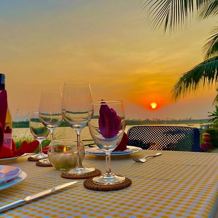 Bel Marina Hoi An Resort Экстерьер фото Sunset at the Riverine Restaurant